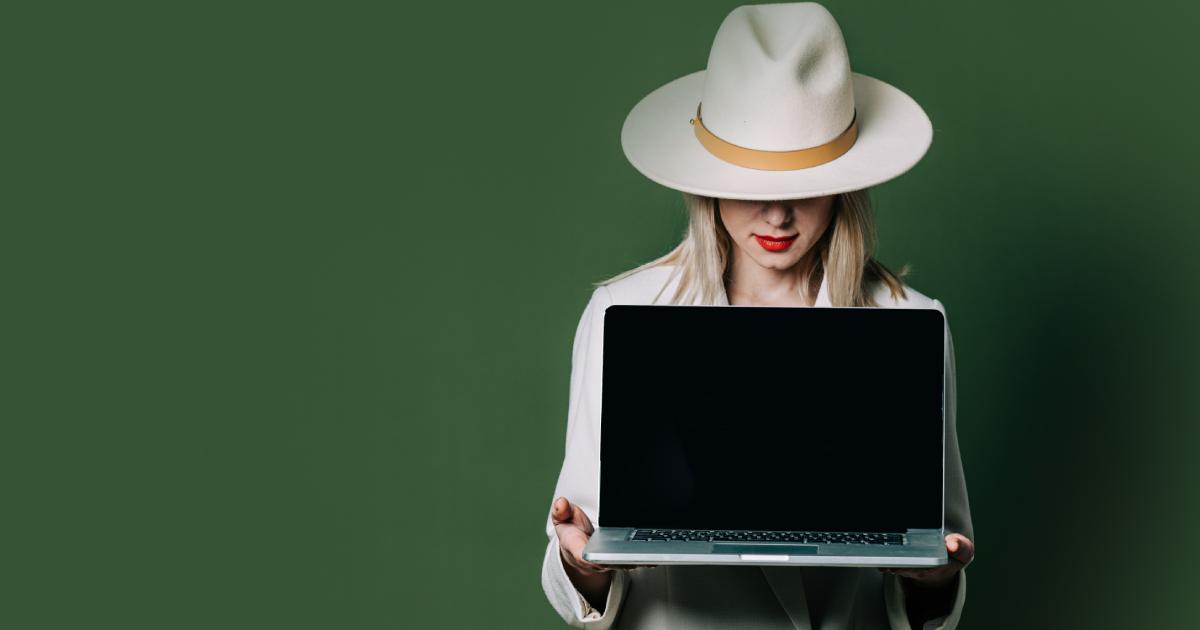 Stylish blond hair woman with laptop on green background | Black Hat And White Hat Seo Practices